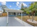 Newly renovated home with carport, and landscaping at 3612 W Leila Ave, Tampa, FL 33611