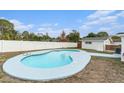 Inviting kidney-shaped pool with a large deck at 6317 S Lansdale Cir, Tampa, FL 33616