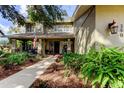 Inviting home exterior with landscaped walkway and porch at 390 Cypress Creek Cir, Oldsmar, FL 34677