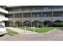 Building exterior showcasing walkway and landscaping at 2462 Brazilia Dr # 20, Clearwater, FL 33763