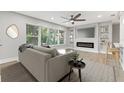 Living room with hardwood floors, fireplace, and neutral color palette at 623 15Th Nw Ave, Largo, FL 33770