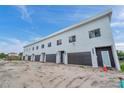 Modern townhome building with attached garages and ample parking at 2608 W Columbus Dr # 3, Tampa, FL 33607