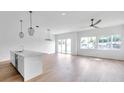 Open concept living space with hardwood floors and modern kitchen at 2608 W Columbus Dr # 3, Tampa, FL 33607