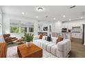 Bright living room with modern furniture and an open floor plan at 11509 Waterway Dr, Parrish, FL 34219