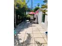 Outdoor patio with table & chairs, perfect for dining al fresco at 105 162Nd Ave, Redington Beach, FL 33708