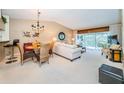 Bright dining area with table and chairs, adjacent to living room at 14880 Shipwatch Trce # 1915, Largo, FL 33774