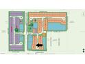 Community overview with multiple homes and a pond at 17925 Nadine Pl, Nokomis, FL 34275
