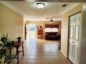 Spacious living area with tile floors and access to the front door at 10863 112Th Pl, Largo, FL 33778