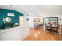 Open concept dining area with hardwood floors and stylish decor at 2383 Indian E Trl, Palm Harbor, FL 34683