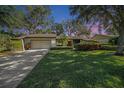 Inviting home exterior at dusk, showcasing curb appeal at 2383 Indian E Trl, Palm Harbor, FL 34683