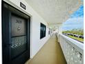 Bright hallway with access to condo unit, showing building exterior at 4910 Bay Ne St # 309, St Petersburg, FL 33703