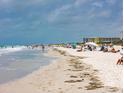 Relaxing beach scene with people enjoying the sun at 102 87Th Ave, Treasure Island, FL 33706