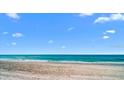 Stunning beach view with clear water and sandy shore at 102 87Th Ave, Treasure Island, FL 33706