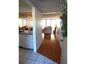 View of kitchen and living room from condo entry at 14130 Rosemary Ln # 2102, Largo, FL 33774