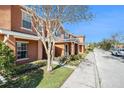 Townhome community showcasing multiple units and a tree-lined street at 2066 Sun Down Dr 2066 Sun Down Dr, Clearwater, FL 33763