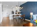 Bright dining area with mid-century modern table and chairs at 132 Mirror Lake N Dr # 404, St Petersburg, FL 33701