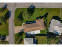 Single story home, large yard, and neighborhood view at 1957 Temple Ter, Clearwater, FL 33764