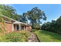 Brick house with a stone pathway leading to the entrance at 215 S West Shore Blvd, Tampa, FL 33609