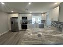 Modern kitchen features stainless steel appliances and granite countertops at 3448 100Th N Ter, Pinellas Park, FL 33782