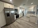 Modern kitchen with stainless steel appliances and granite countertops at 3448 100Th N Ter, Pinellas Park, FL 33782