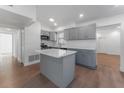Modern kitchen with gray cabinets and quartz countertops at 5100 3Rd S Ave, St Petersburg, FL 33707