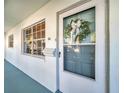 Welcoming front door with a seasonal wreath and a bright window, adding a touch of charm to the entrance at 11200 102Nd N Ave # 66, Seminole, FL 33778