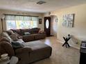 Spacious living room featuring a large sectional sofa at 10373 137Th Ln, Largo, FL 33774