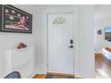 Inviting entryway with white door and wood floors at 323 30Th N Ave, St Petersburg, FL 33704