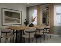 Elegant dining room with a large wooden table and modern chairs at 1520 Alameda, Spring Hill, FL 34609
