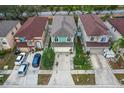 Aerial view showcasing a row of houses with red and brown roofs at 1613 Prowmore Dr, Brandon, FL 33511