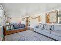 Bright sunroom with comfortable seating and plenty of natural light at 3407 King George Ln, Seffner, FL 33584