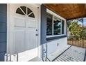 White front door with a semi-circular window at 4051 30Th N Ave, St Petersburg, FL 33713