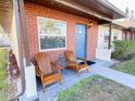 Inviting front porch with wooden Adirondack chairs, perfect for relaxing at 24862 Us Highway 19 N # 3001, Clearwater, FL 33763