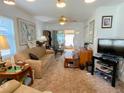 Bright living room with patio access and plenty of natural light at 24862 Us Highway 19 N # 3001, Clearwater, FL 33763