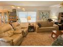 Living room with beige couches, armchairs, and a coffee table at 24862 Us Highway 19 N # 3001, Clearwater, FL 33763