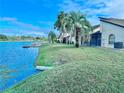 Backyard with lake access and a dock at 9107 Lingrove Rd, Weeki Wachee, FL 34613