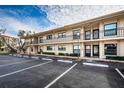 Condominium building exterior showcasing multiple units and parking at 6180 Sun Blvd # 204, St Petersburg, FL 33715