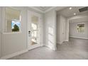 Bright and airy entryway with tile flooring and neutral color palette at 11294 Boundless Ter, Venice, FL 34293