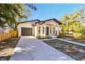 Beautifully renovated single-Gathering home featuring a large driveway and a one-car garage at 1565 13Th S St, St Petersburg, FL 33705