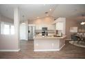 Modern kitchen featuring stainless steel appliances and an island breakfast bar at 1533 Rolling Meadow Dr, Valrico, FL 33594