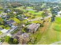 Aerial view showcasing the home's location in a peaceful golf course community at 435 Palmdale Dr, Oldsmar, FL 34677