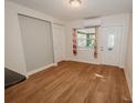 Bright dining area with wood-look floors and access to the kitchen at 519 Greenway Dr, Plant City, FL 33566