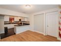 Modern kitchen with white cabinets and granite countertops at 519 Greenway Dr, Plant City, FL 33566