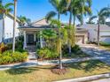 Charming single-story house with manicured landscaping and a welcoming front porch at 5205 Covesound Way, Apollo Beach, FL 33572