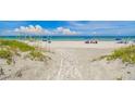 Beach access path with boardwalk leading to the ocean at 322 Windrush Blvd # 4, Indian Rocks Beach, FL 33785