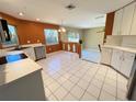Kitchen with stainless steel appliances and orange walls at 3619 Springville Dr, Valrico, FL 33596