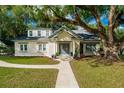 Beautiful brick house with a welcoming front porch and lush lawn at 37439 Meridian Ave, Dade City, FL 33525