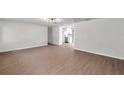 Open concept living room with kitchen view and hardwood floors at 9126 109Th Ter, Seminole, FL 33777