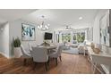 Bright dining room with hardwood floors and modern chandelier at 125 Mariner Dr # 125, Tarpon Springs, FL 34689