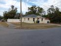 Newly constructed home with a fenced yard and paved driveway at 1302 E Annie St, Tampa, FL 33612